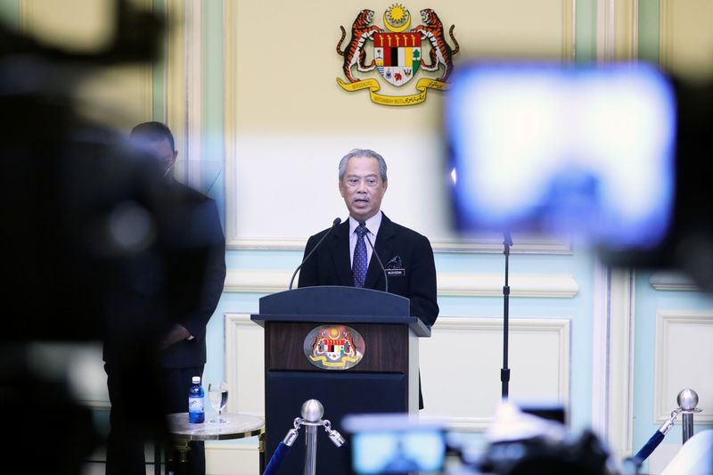 &copy; Reuters. FILE PHOTO: Malaysia&apos;s Prime Minister Muhyiddin Yassin speaks during his cabinet announcement in Putrajaya