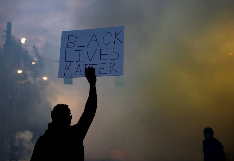&copy; Reuters. FILE PHOTO: Protesters rally against the death in Minneapolis police custody of George Floyd, in Seattle