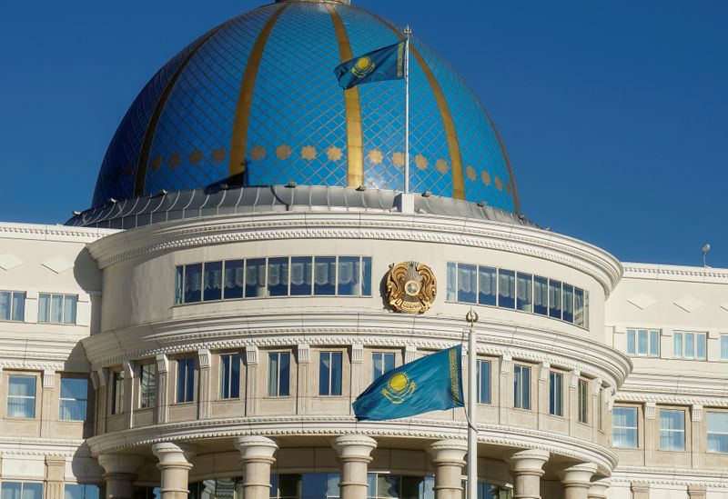 &copy; Reuters. National flags and emblem are seen on Akorda, the official residence of Kazakhstan&apos;s President, in Astana, Kazakhstan