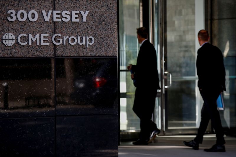 &copy; Reuters. Men enter the CME Group offices in New York
