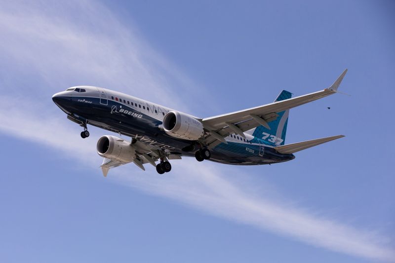 &copy; Reuters. FILE PHOTO: A Boeing 737 MAX airplane lands after a test flight at Boeing Field in Seattle