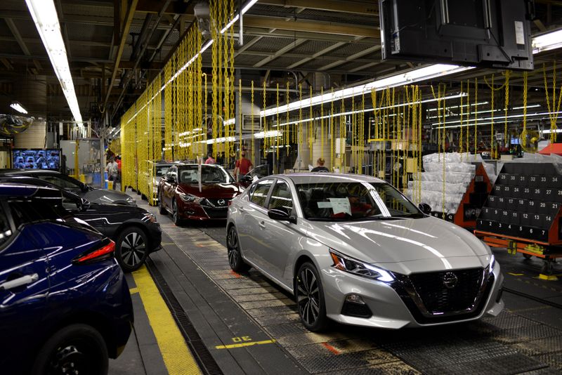 &copy; Reuters. FILE PHOTO: A finished Nissan Maxima followed by a Nissan Altima comes off the line at Nissan Motor Co&apos;s automobile manufacturing plant in Smyrna Tennessee