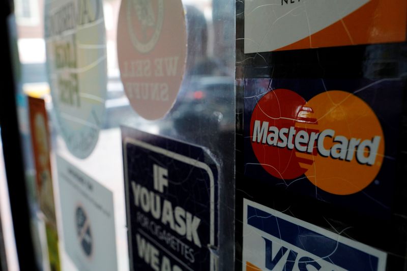 &copy; Reuters. A sticker shows that a store accepts MasterCard in Harvard Square in Cambridge