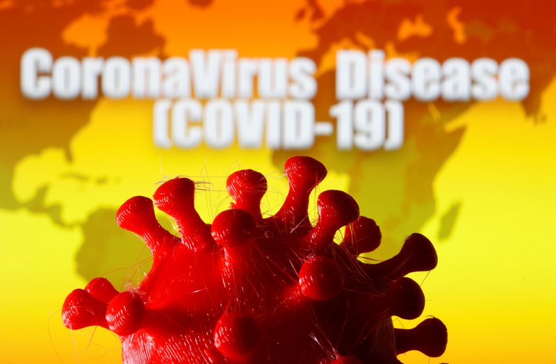 &copy; Reuters. A 3D-printed coronavirus model is seen in front of a world map and the words &quot;CoronaVirus Disease (Covid-19)&quot; on display in this illustration