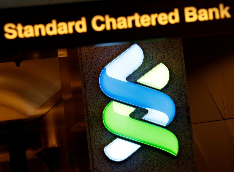 &copy; Reuters. FILE PHOTO: A logo of Standard Chartered is displayed at its main branch in Hong Kong