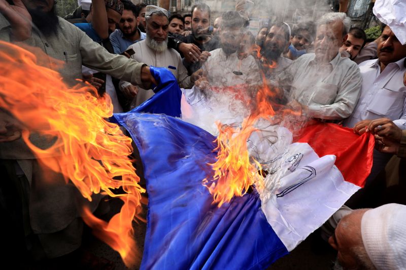 &copy; Reuters. People protest against the cartoon publications of Prophet Mohammad in France and comments by the French President Emmanuel Macron, in Peshawar