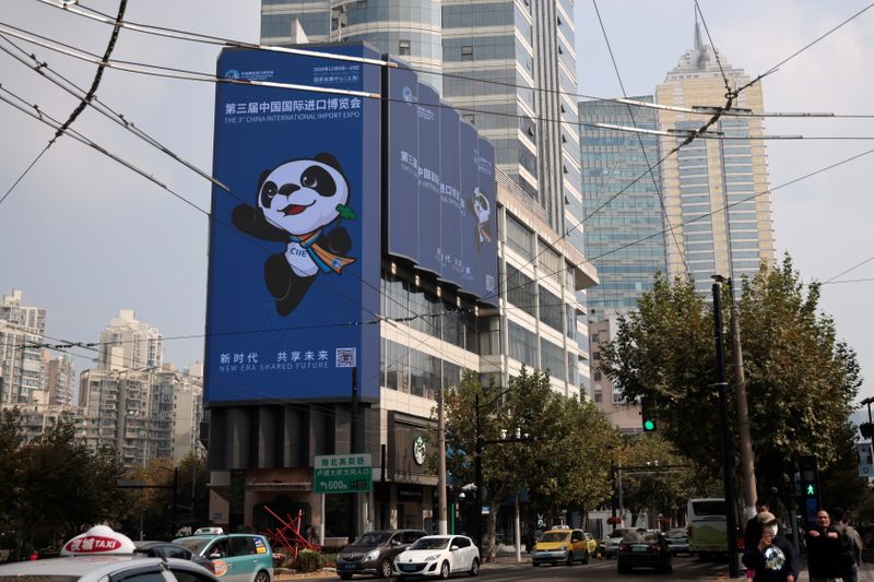 &copy; Reuters. Signs promoting the upcoming the third CIIE are displayed in Shanghai