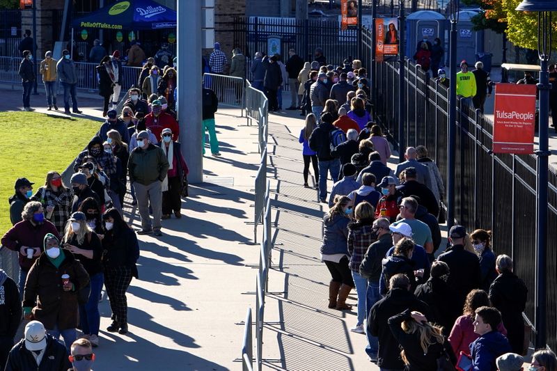 &copy; Reuters. Voters wait in line to cast their ballots during early voting at ONEOK Field in Tulsa