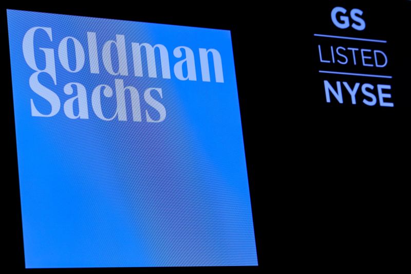 © Reuters. FILE PHOTO: FILE PHOTO: The ticker symbol and logo for Goldman Sachs is displayed on a screen on the floor at the NYSE in New York