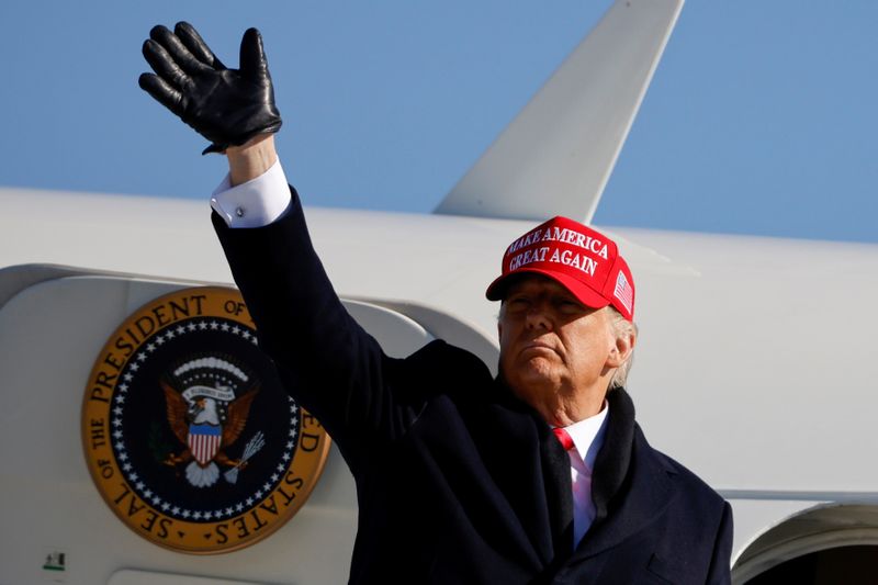 &copy; Reuters. FILE PHOTO: U.S. President Donald Trump gestures as he leaves after holding a campaign rally at Fayetteville Regional Airport in Fayetteville