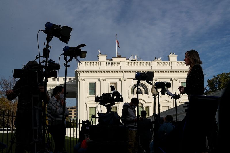 &copy; Reuters. A television correspondent reports outside the White House on Election Day in Washington