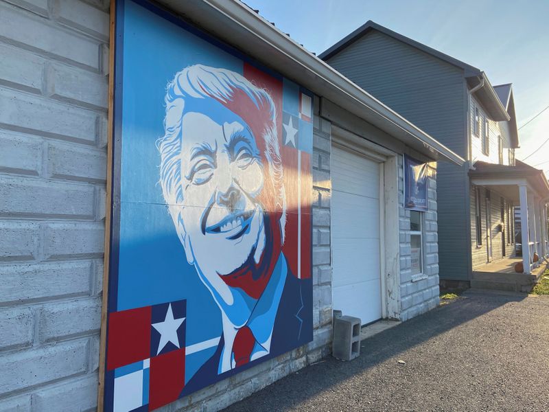 &copy; Reuters. A mural of a smiling U.S. President Donald Trump commissioned by Randy Bunch, a commissioner in Fulton County, is seen on the side of a business on Election Day in McConnellsburg, Pennsylvania