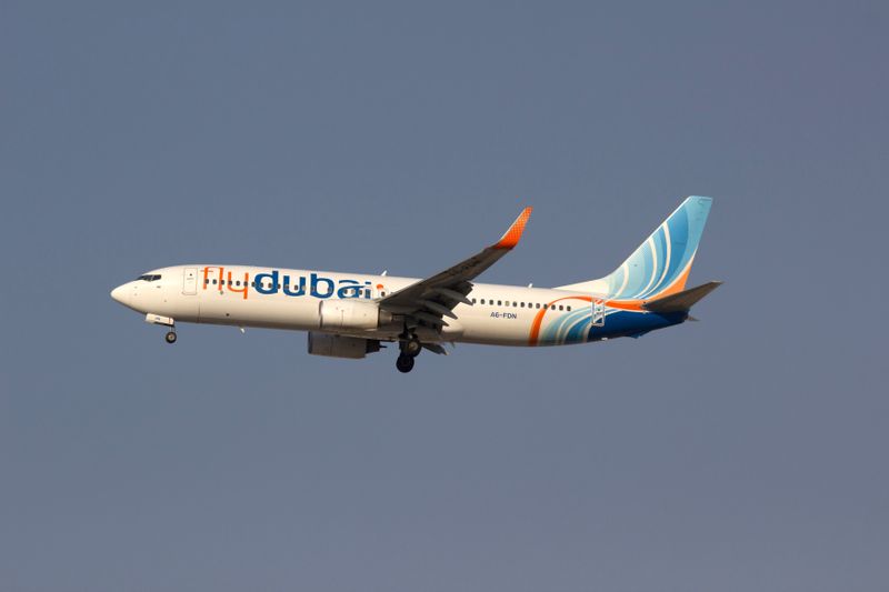 © Reuters. FILE PHOTO: A Flydubai airplane is pictured in the sky over Dubai