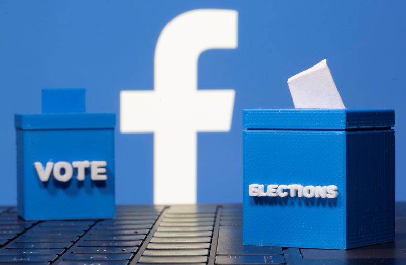 © Reuters. 3D printed ballot boxes are seen in front of a displayed Facebook logo