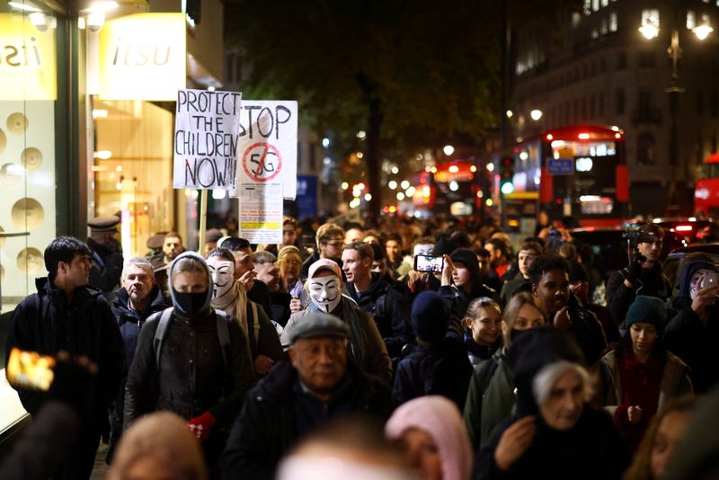 &copy; Reuters. Protestors from the Million Mask March and anti lockdown protesters demonstrate in London