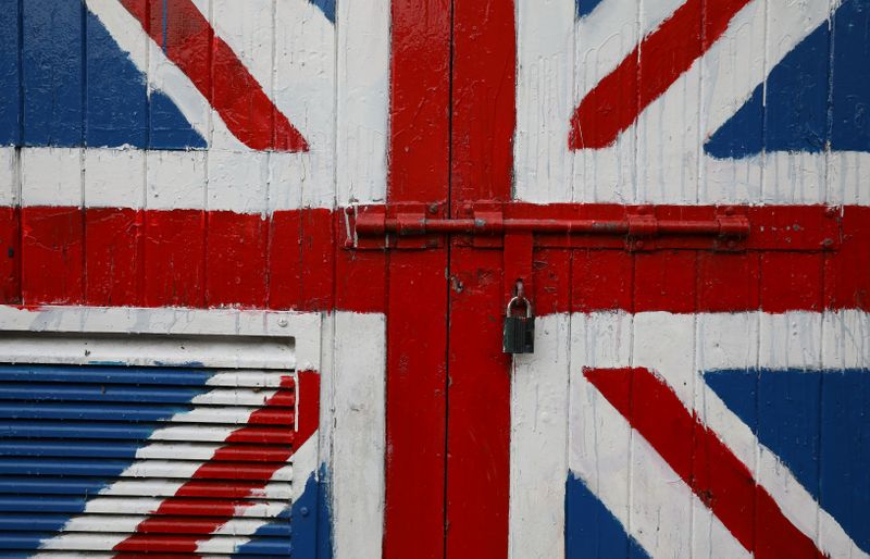 &copy; Reuters. A padlock is seen on a door covered with a Union Jack mural on the Fountain Estate in Londonderry, Northern Ireland
