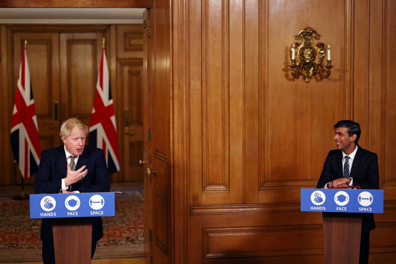 &copy; Reuters. FILE PHOTO: Britain&apos;s PM Johnson attends a news conference in London