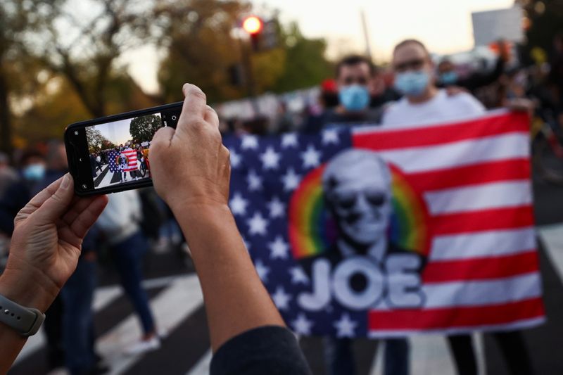 © Reuters. People gather at Black Lives Matter Plaza near the White House after Election Day in Washington