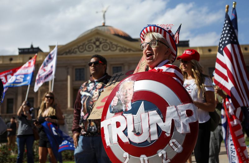 © Reuters. Supporters of U.S. President Donald Trump gather at a 