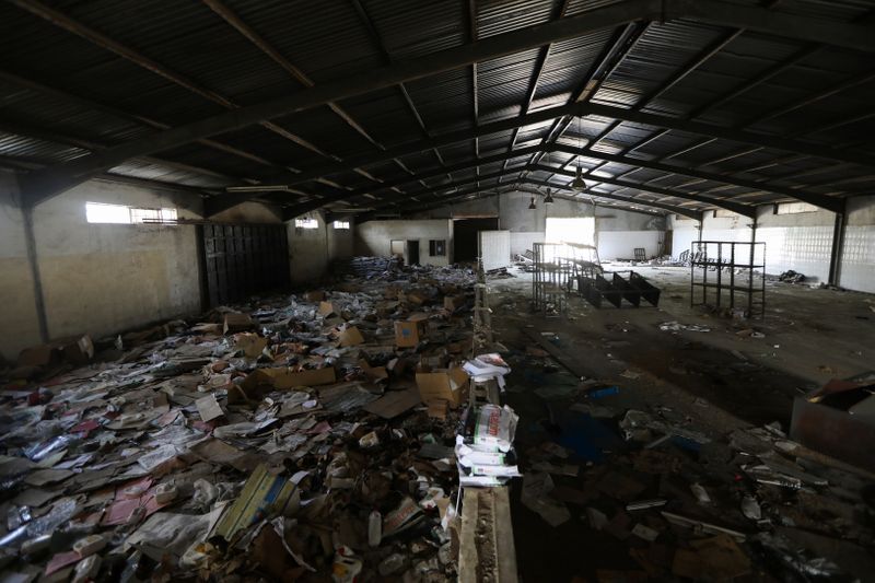 &copy; Reuters. Damaged items left behind at the NEMA warehouse are seen on the ground in Abuja