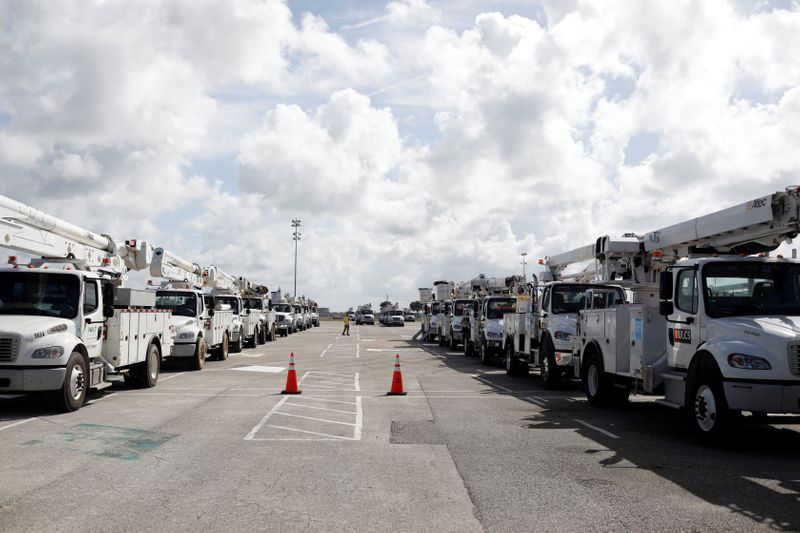 &copy; Reuters. Trucks of the Florida Power &amp; Light Company are seen ahead of the arrival of Hurricane Dorian in Daytona Beach