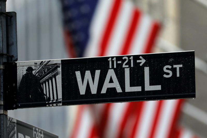 &copy; Reuters. FILE PHOTO: Raindrops hang on a sign for Wall Street outside the New York Stock Exchange in New York