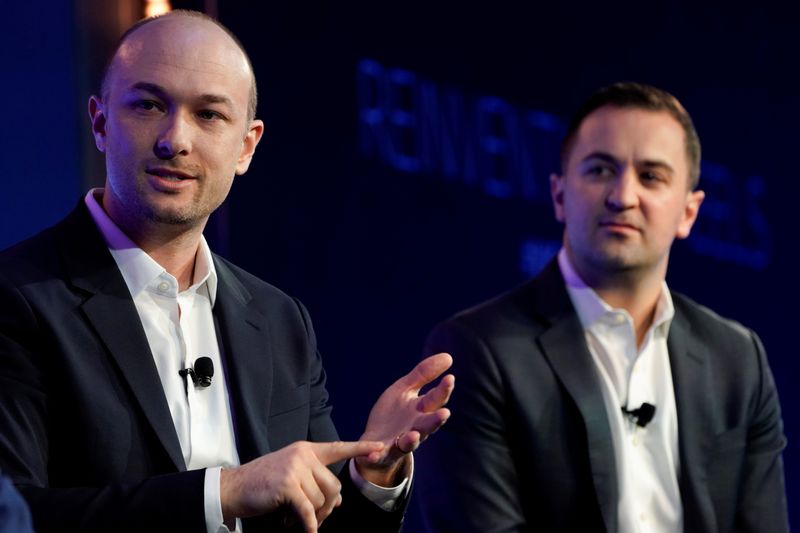 © Reuters. FILE PHOTO: Lyft's cofounders, Green and Zimmer, speak at the 2019 WSJTECH live conference in Laguna Beach, California