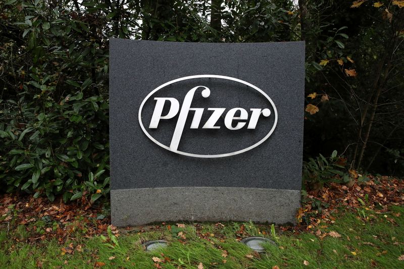 &copy; Reuters. The Pfizer logo is seen at their UK commercial headquarters in Walton Oaks