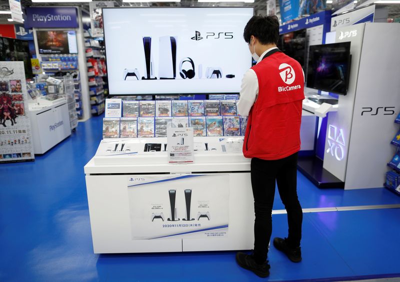 &copy; Reuters. An employee works at the promotion display for the Sony PlayStation 5 game console and its gaming softwares in Tokyo