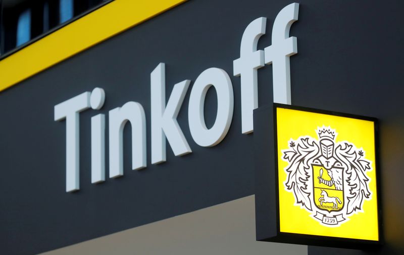 &copy; Reuters. FILE PHOTO: The logo of Tinkoff Bank is seen on a board at the St. Petersburg International Economic Forum