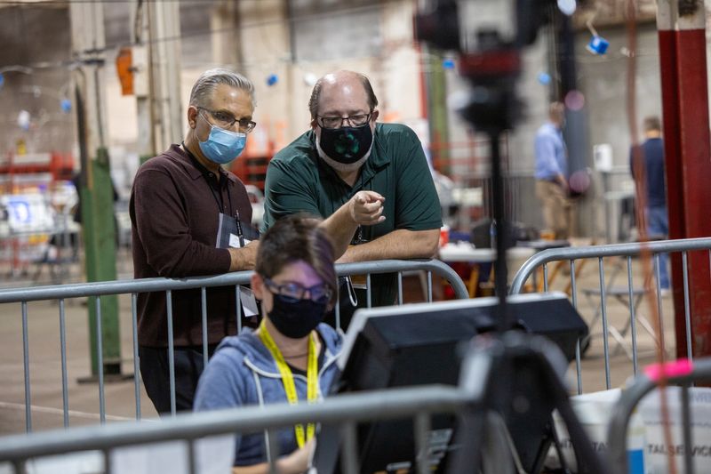 &copy; Reuters. Poll workers tabulate ballots at the Allegheny County Election Warehouse in Pittsburgh