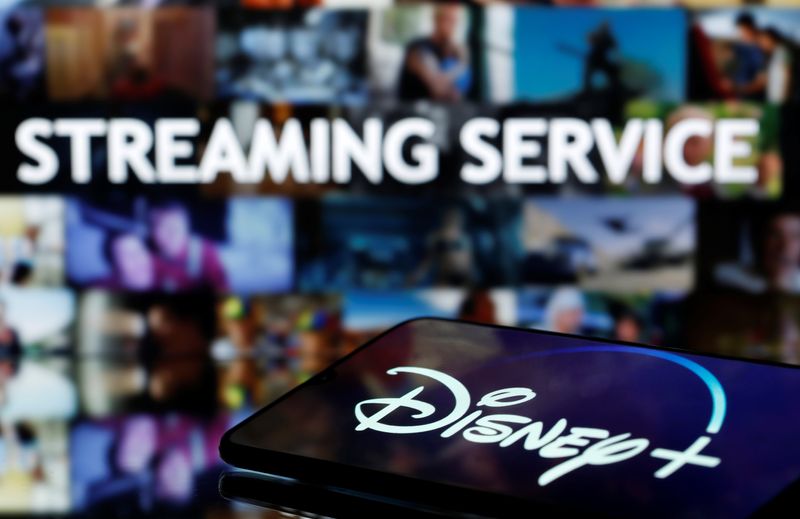 &copy; Reuters. FILE PHOTO: Smartphone with displayed &quot;Disney&quot; logo is seen in front of displayed &quot;Streaming service&quot; words in this illustration