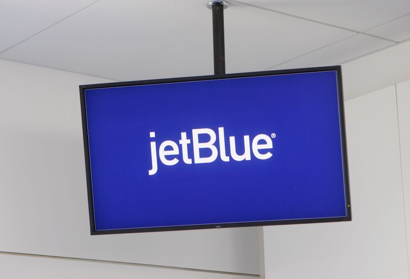 &copy; Reuters. FILE PHOTO: JetBlue Airways logo is displayed on a monitor in Terminal 5 at JFK International Airport in New York