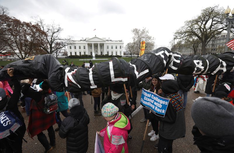 © Reuters. FILE PHOTO: Indigenous leaders participate in protest march and rally outside White House in Washington