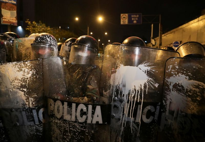 &copy; Reuters. Police officers hold their riot shields covered in paint during protests following the impeachment of President Martin Vizcarra, in Lima