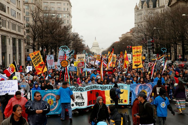 © Reuters. FILE PHOTO: Indigenous leaders participate in protest march and rally in Washington