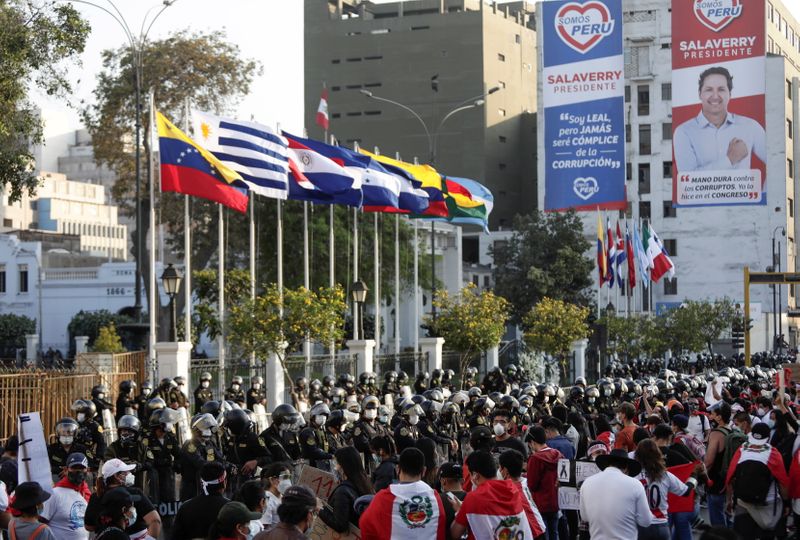 &copy; Reuters. People gather outside Congress after Peru&apos;s interim President Manuel Merino announced his resignation, in Lima