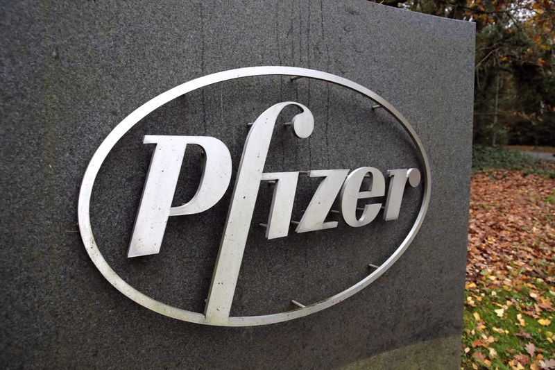 &copy; Reuters. The Pfizer logo is seen at their UK commercial headquarters in Walton Oaks