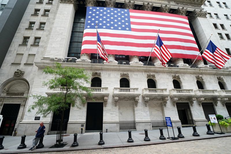 &copy; Reuters. A trader stands outside the New York Stock Exchange in the financial district