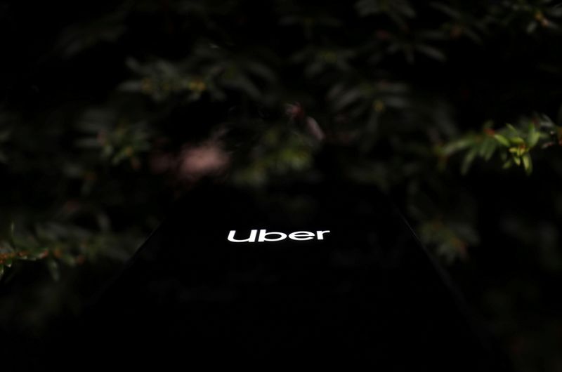 &copy; Reuters. FILE PHOTO: The Uber logo is displayed on a mobile phone in this picture illustration