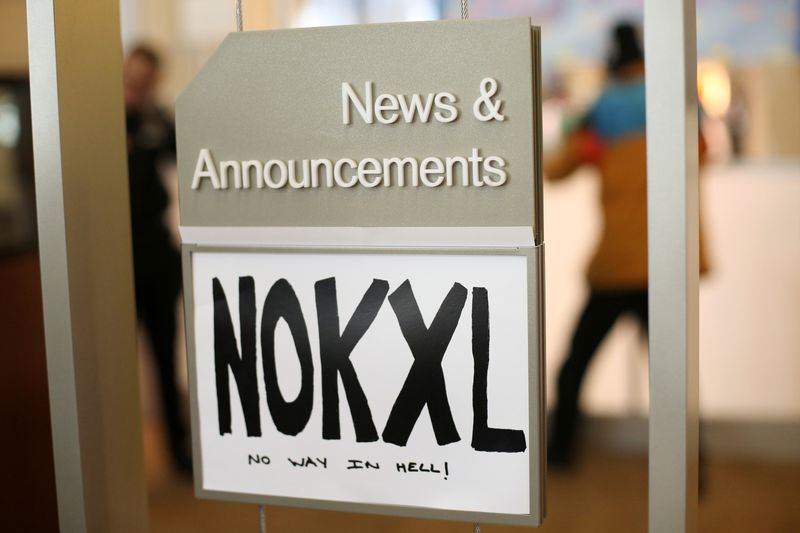 &copy; Reuters. FILE PHOTO: A sign opposing the Keystone XL Pipeline is seen inside of a Chase Bank location while Native American leaders and climate activists demonstrate in Seattle, Washington