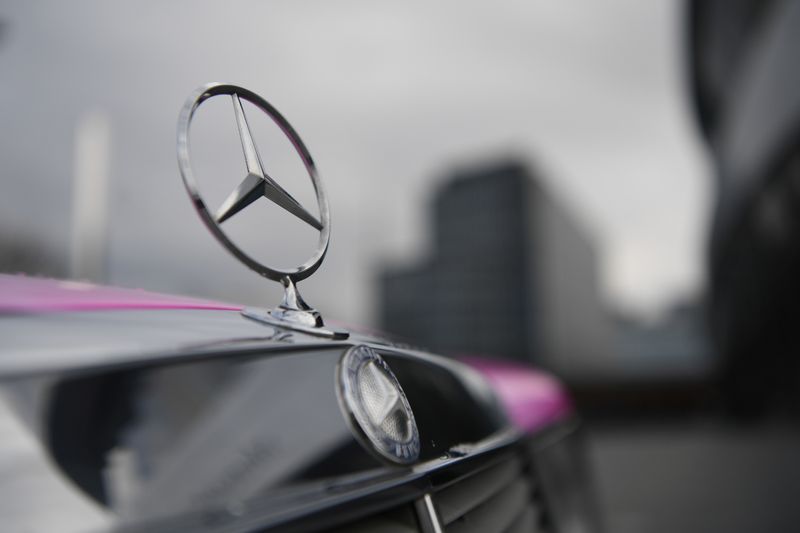 &copy; Reuters. The Mercedes-Benz logo is seen on a car in front of the Mercedes-Benz Museum in Stuttgart
