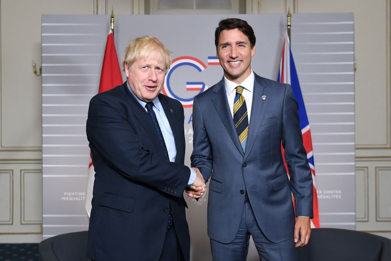 &copy; Reuters. FILE PHOTO: PMs Johnson and Trudeau at G7 summit 2019 in Biarritz