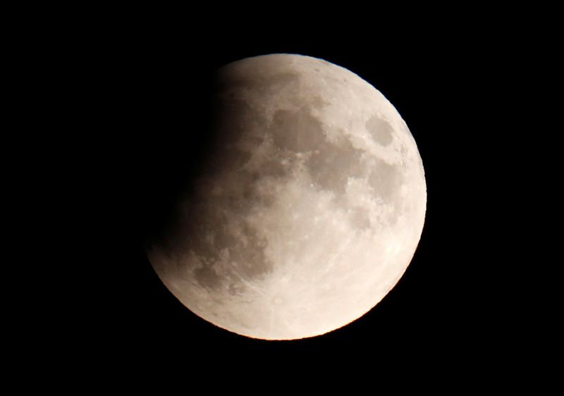 &copy; Reuters. A partial lunar eclipse is seen in Berlin