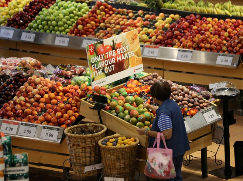 &copy; Reuters. FILE PHOTO: A woman browses in the fruit section of a Loblaw supermarket in Collingwood