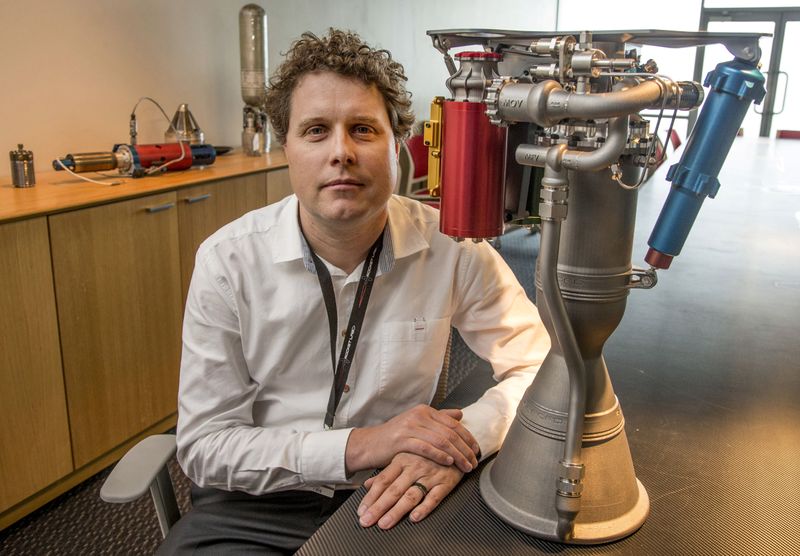 &copy; Reuters. FILE PHOTO: Rocket Lab CEO Peter Beck sits alongside a Rutherford rocket engine in Auckland