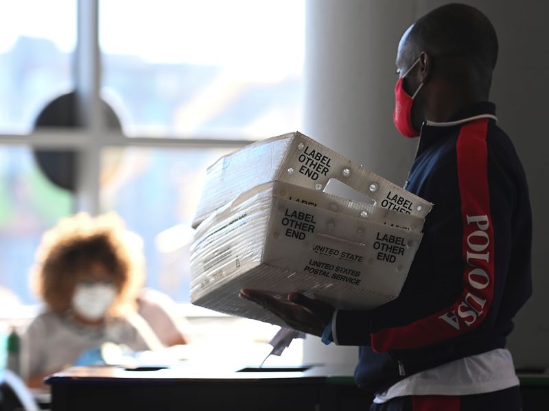 &copy; Reuters. FILE PHOTO: Employees of the Fulton County Board of Registration and Elections process ballots in Atlanta