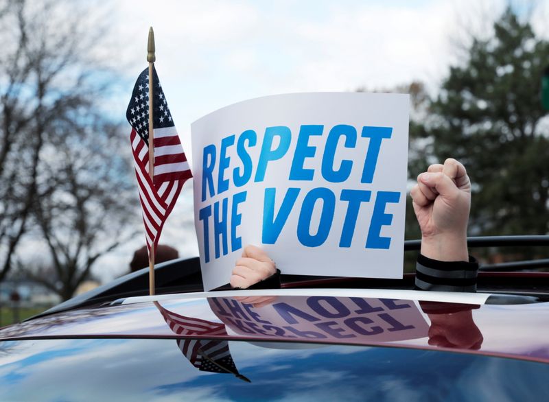 © Reuters. Demonstrators in a car caravan demand the Board of State Canvassers to certify the results of the election