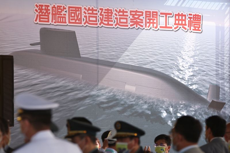 &copy; Reuters. People attend the ceremony for the start of construction of a new submarine fleet in Kaohsiung,