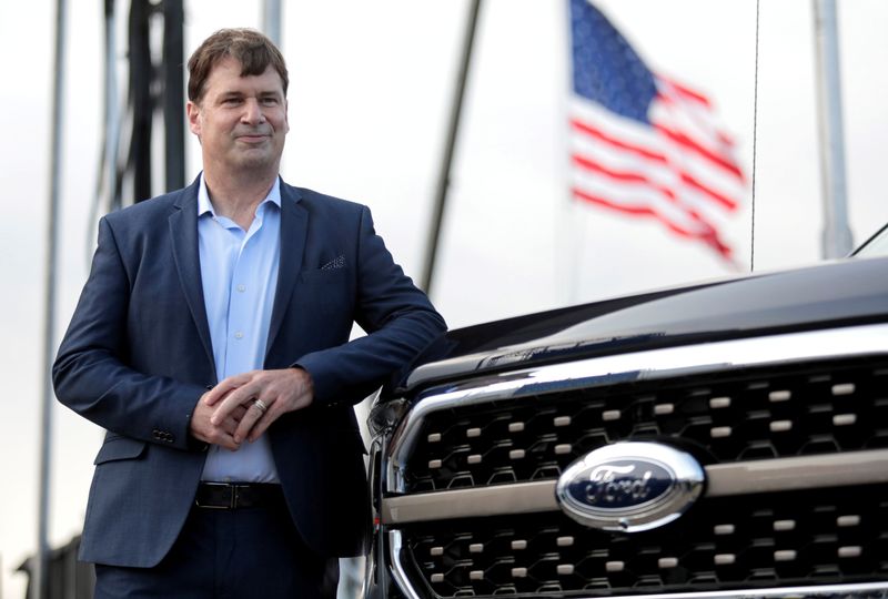&copy; Reuters. FILE PHOTO: Ford Motor Co. CEO Jim Farley poses next to a new 2021 Ford F-150 pickup truck at the Rouge Complex in Dearborn,